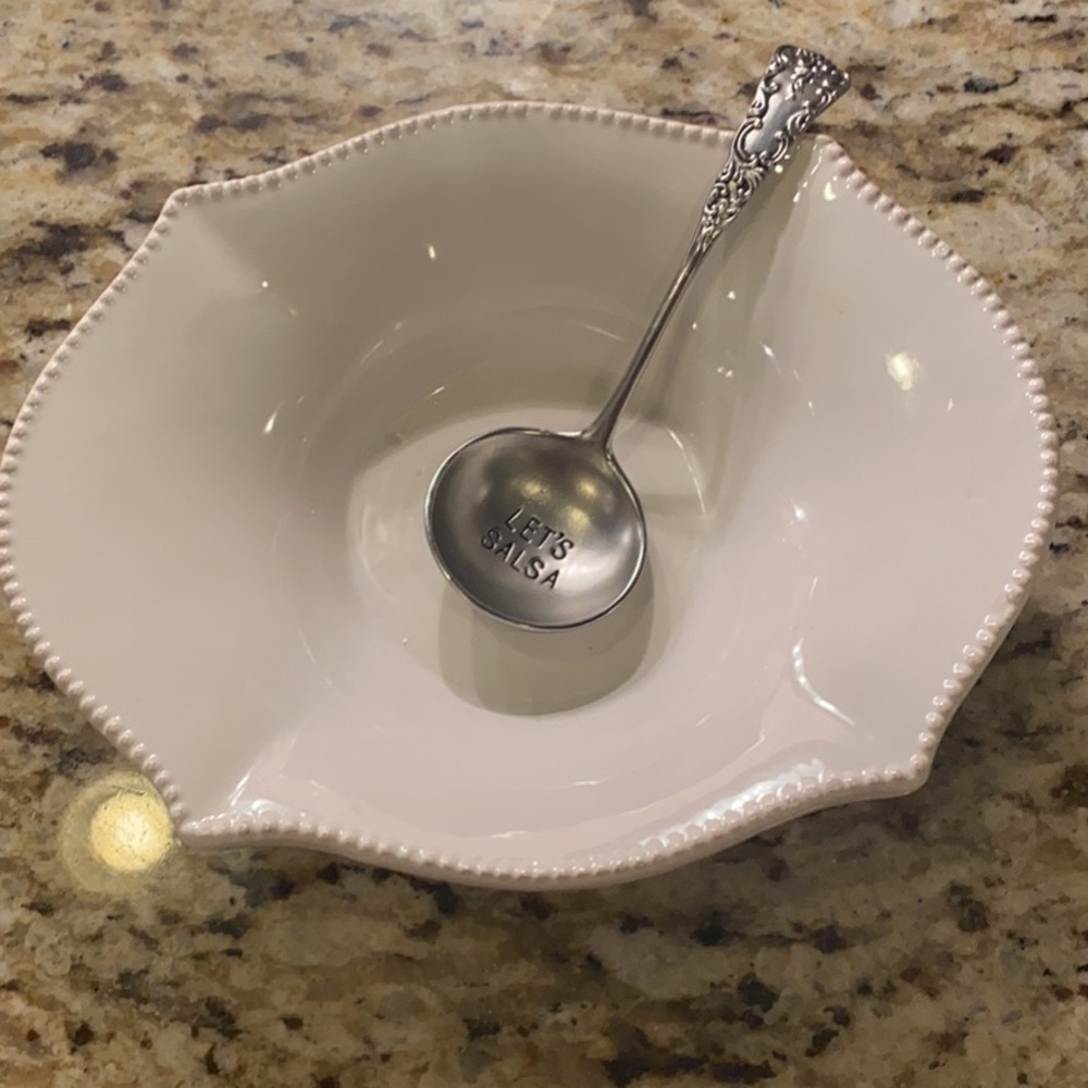 Salsa dish with spoon